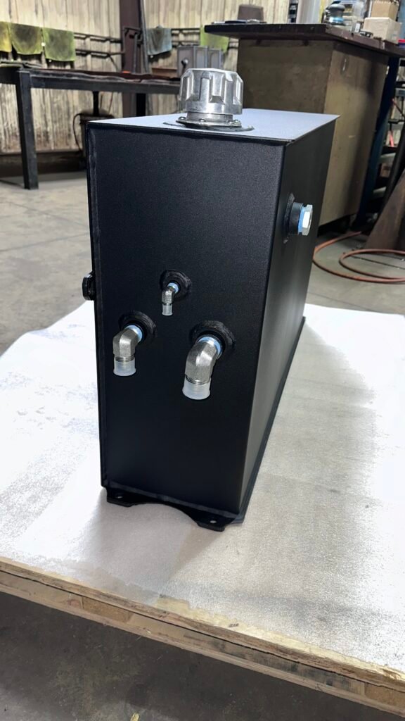 Black powder coat hydraulic tank with angled port fittings – Engineered Welding Inc
