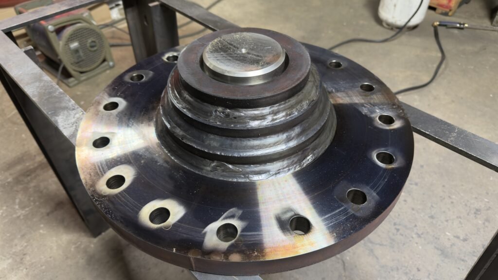 Welded steel flange with multi-pass weld bead fabricated for a Marion Iowa area customer