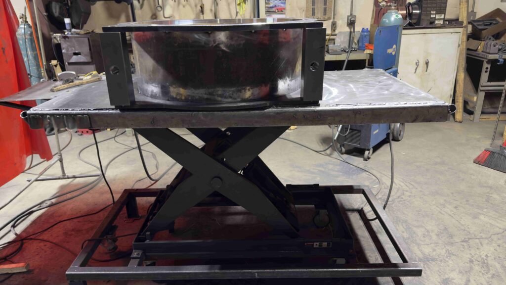 Custom welded steel scissor lift table frame fabricated for a Dubuque area industrial customer
