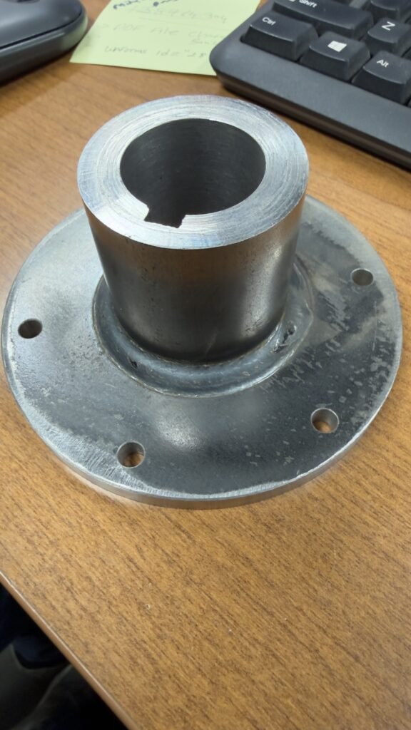 Precision machined steel flange and bushing assembly – Engineered Welding Iowa