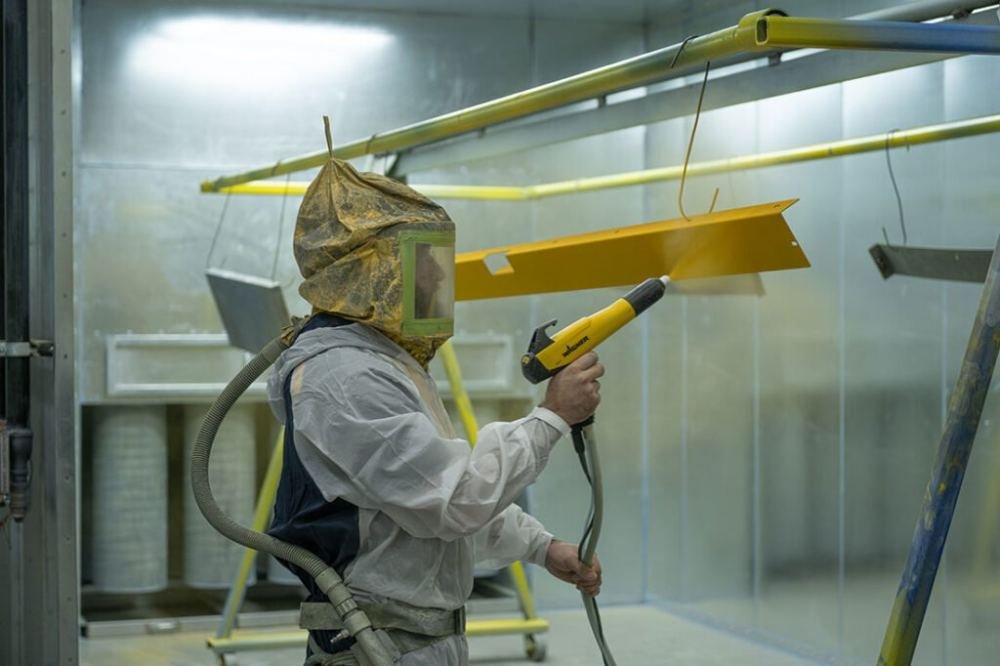 Powder coating surface treatment for metal fabrication parts